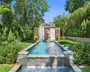 View of pool with a yard and a shed