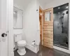 Bathroom featuring tile patterned flooring, a shower, toilet, and crown molding