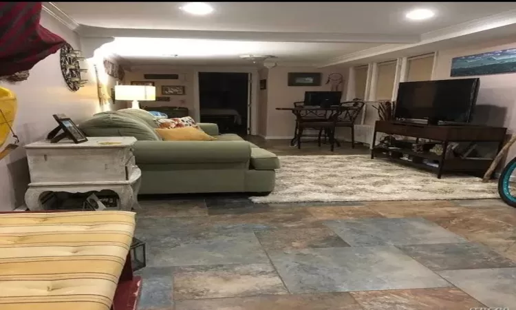 Living room featuring ornamental molding