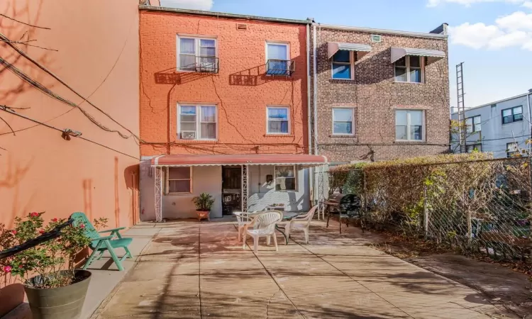 Back of house with a patio area