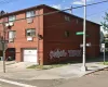 View of building exterior featuring a garage