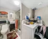 Full bathroom featuring shower / bath combination with glass door, tile patterned flooring, washer and clothes dryer, and toilet