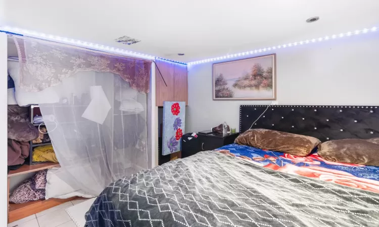 Bedroom featuring light tile patterned floors