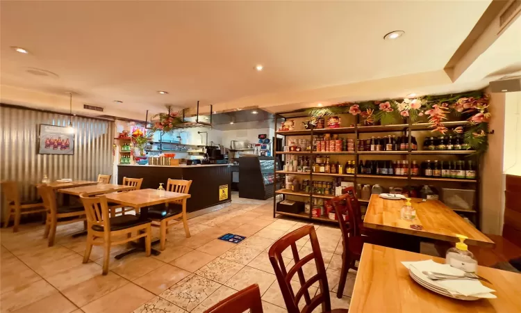 Dining space featuring bar area