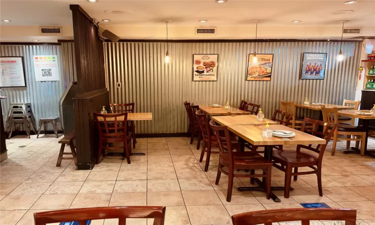 Dining room with light tile patterned floors