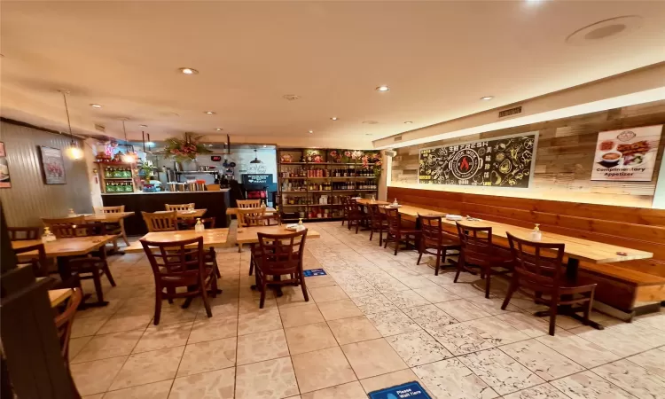 Dining room featuring wooden walls