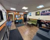 Living room featuring a drop ceiling and wood-type flooring