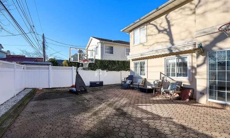 Rear view of property featuring a patio area