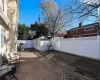 View of patio featuring a shed and cooling unit