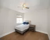 Bedroom with hardwood / wood-style flooring and ceiling fan