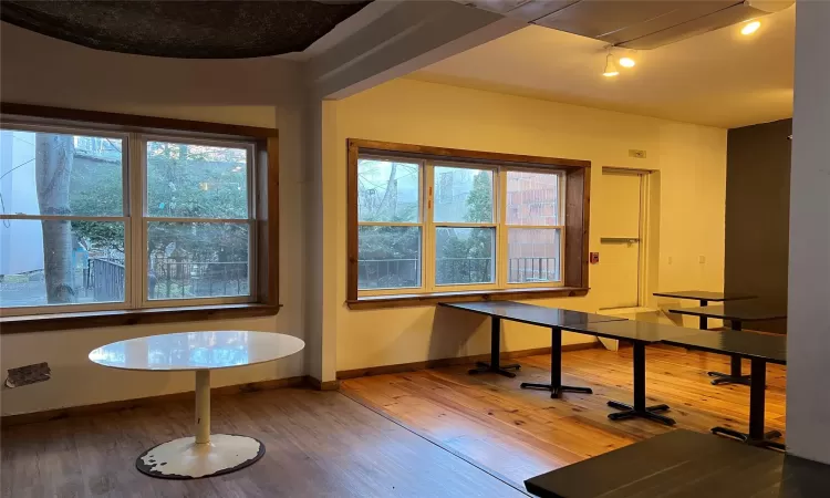 Unfurnished dining area with hardwood / wood-style floors