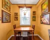 Dining area featuring a notable chandelier and dark hardwood / wood-style flooring