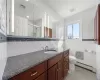 2nd bathroom with bathtub and linen closet and laundry chute