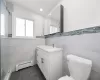 Primary bathroom with stand up shower and linen closet