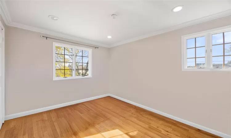 Bedroom with closet and 2 windows