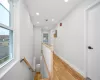 Corridor featuring light hardwood / wood-style flooring