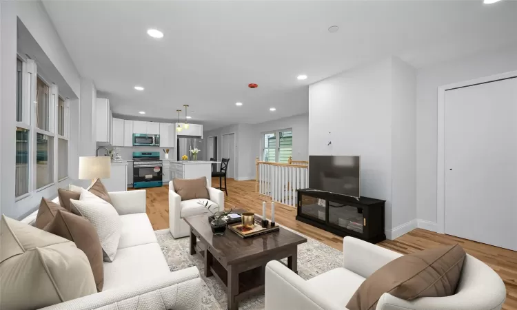 Living room with light hardwood / wood-style floors