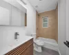 Full bathroom featuring tile patterned floors, vanity, toilet, and tiled shower / bath