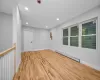 Spare room with light hardwood / wood-style flooring and a baseboard radiator