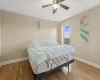 Bedroom with ceiling fan and light hardwood / wood-style flooring