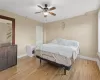 Bedroom featuring light hardwood / wood-style floors and ceiling fan