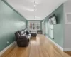 Living room featuring hardwood / wood-style floors and radiator heating unit