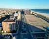 Bird's eye view featuring a view of the beach and a water view