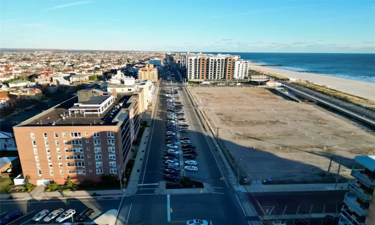 Bird's eye view featuring a view of the beach and a water view