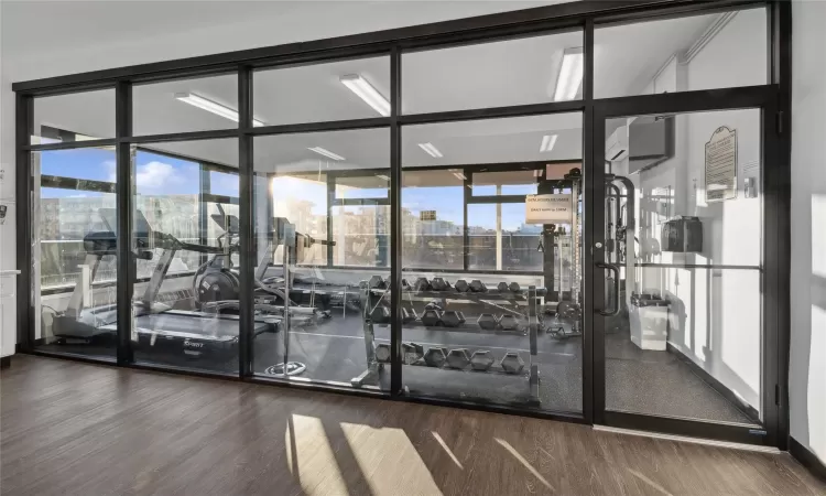 Exercise room featuring hardwood / wood-style flooring