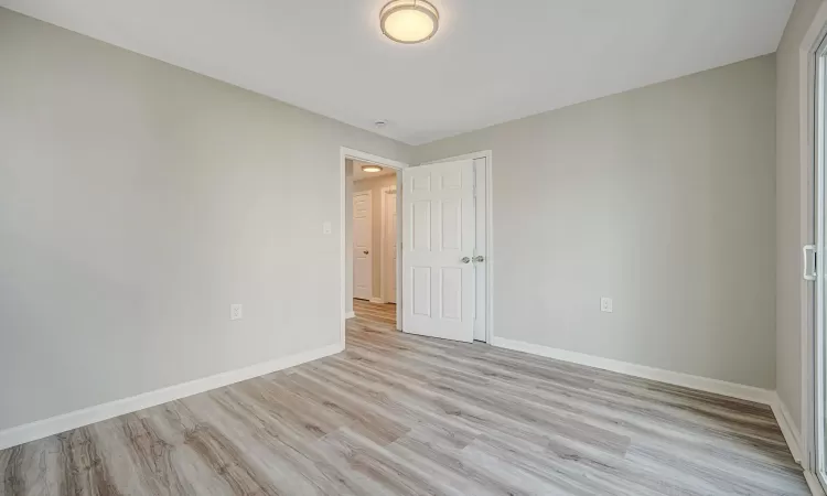 Empty room with light wood-type flooring