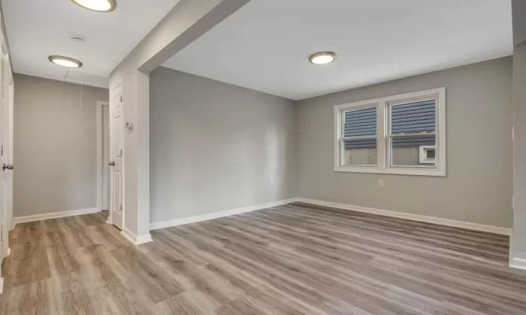 Spare room with light hardwood / wood-style floors