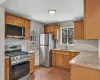 Kitchen with light tile patterned flooring, sink, and stainless steel appliances