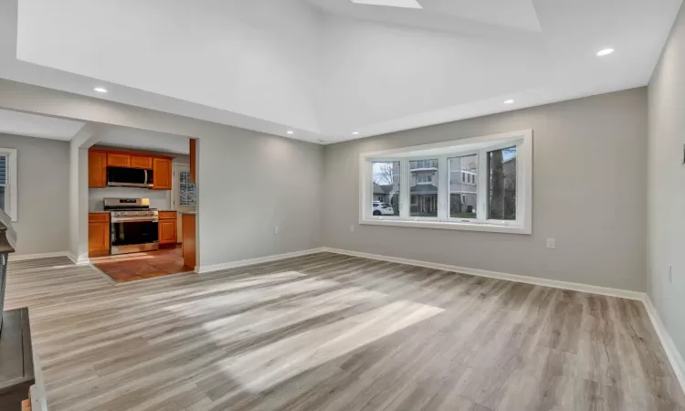 Unfurnished living room with light hardwood / wood-style floors