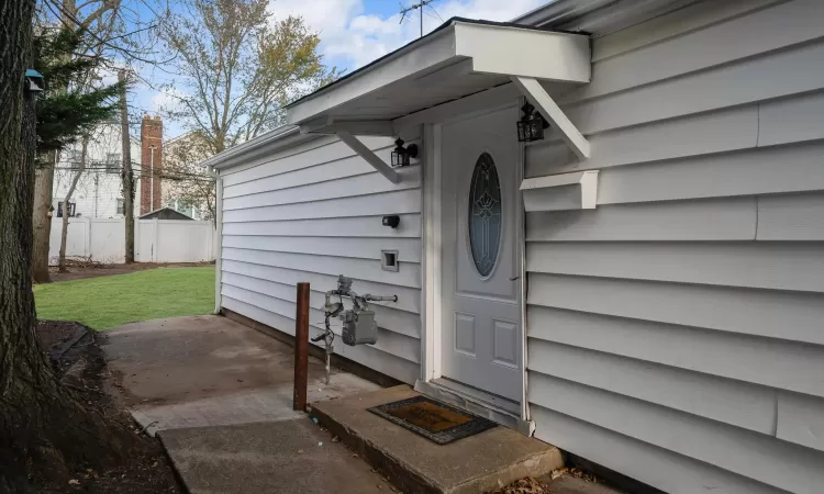 Property entrance with a lawn