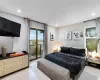 Bedroom featuring light hardwood / wood-style floors and access to outside