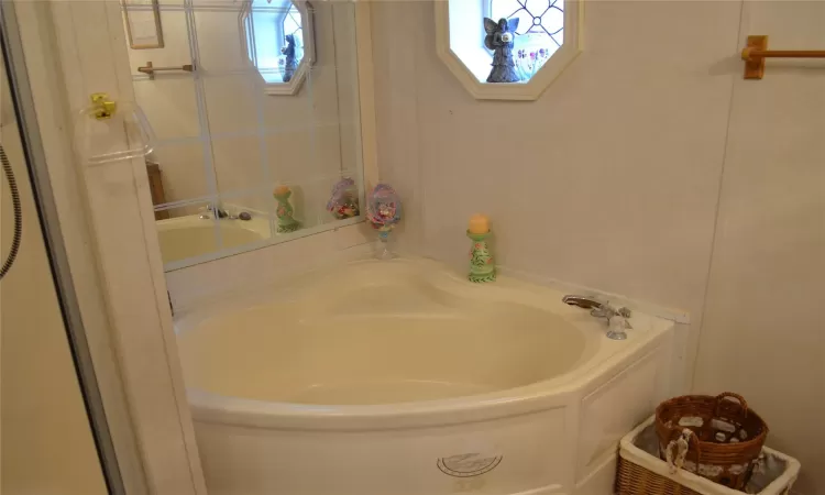 Bathroom with a tub to relax in