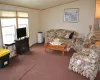 Living room featuring crown molding and high ceilings