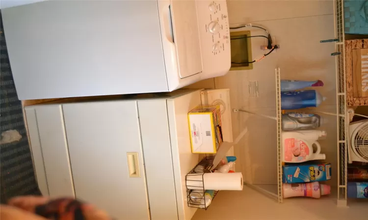 Washroom with washer and clothes dryer