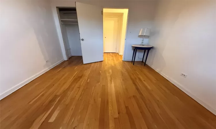 Bedroom featuring Hardwood Flooring