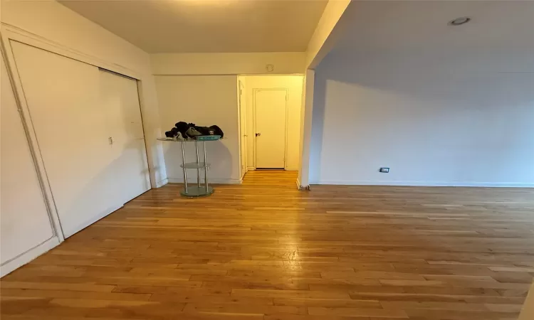 Entryway view of Hallway featuring Hardwood Flooring