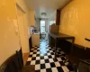 Kitchen with Checkered Flooring and White Cabinets