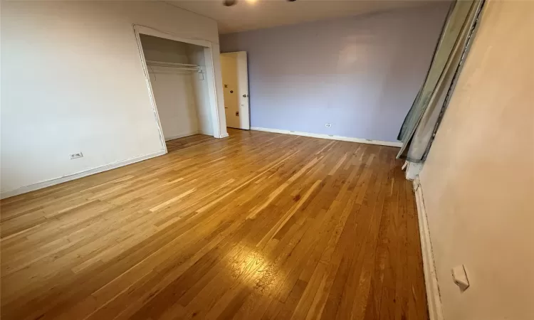 Primary Bedroom featuring Hardwood Flooring