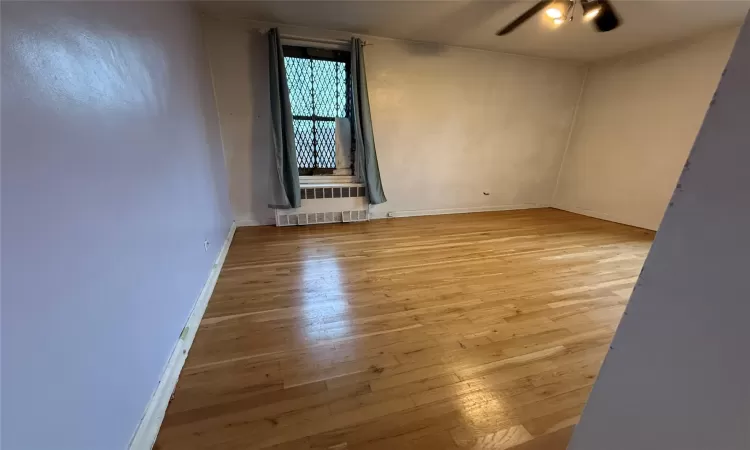 Primary Bedroom featuring Hardwood Flooring