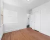 Unfurnished bedroom featuring wood-type flooring