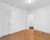 Unfurnished room featuring light parquet floors