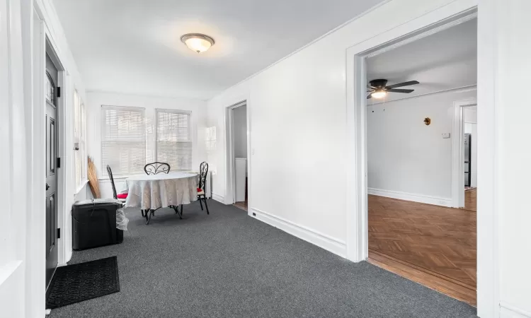 Hallway featuring dark parquet flooring