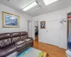 Living room with light hardwood / wood-style floors