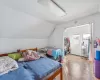 Bedroom featuring lofted ceiling