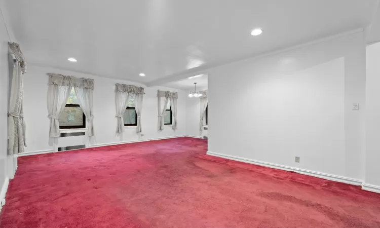 Spare room with carpet floors and crown molding