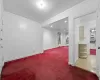 Living room with crown molding, a chandelier, and hardwood / wood-style flooring